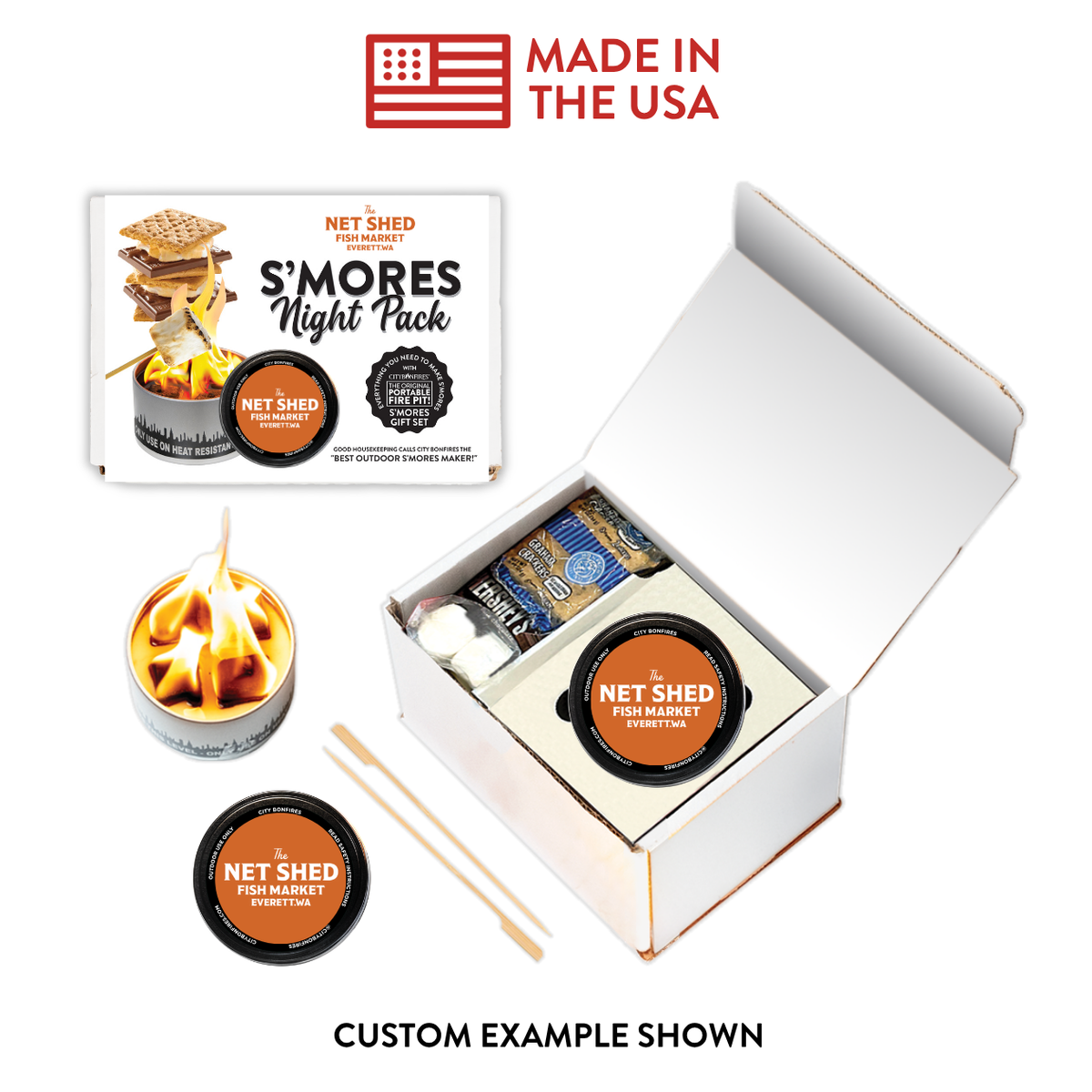 Net Shed S'mores Night Pack kit shown with its open white box, a printed package insert, a small flame candle, a round tin, wooden sticks, and a 'Made in the USA' badge on a white background.