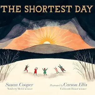 Book cover for 'The Shortest Day' by Susan Cooper, illustrated by Carson Ellis, featuring a stylized winter landscape with a large glowing sun over dark mountains and bare trees, and four children running in the snow.