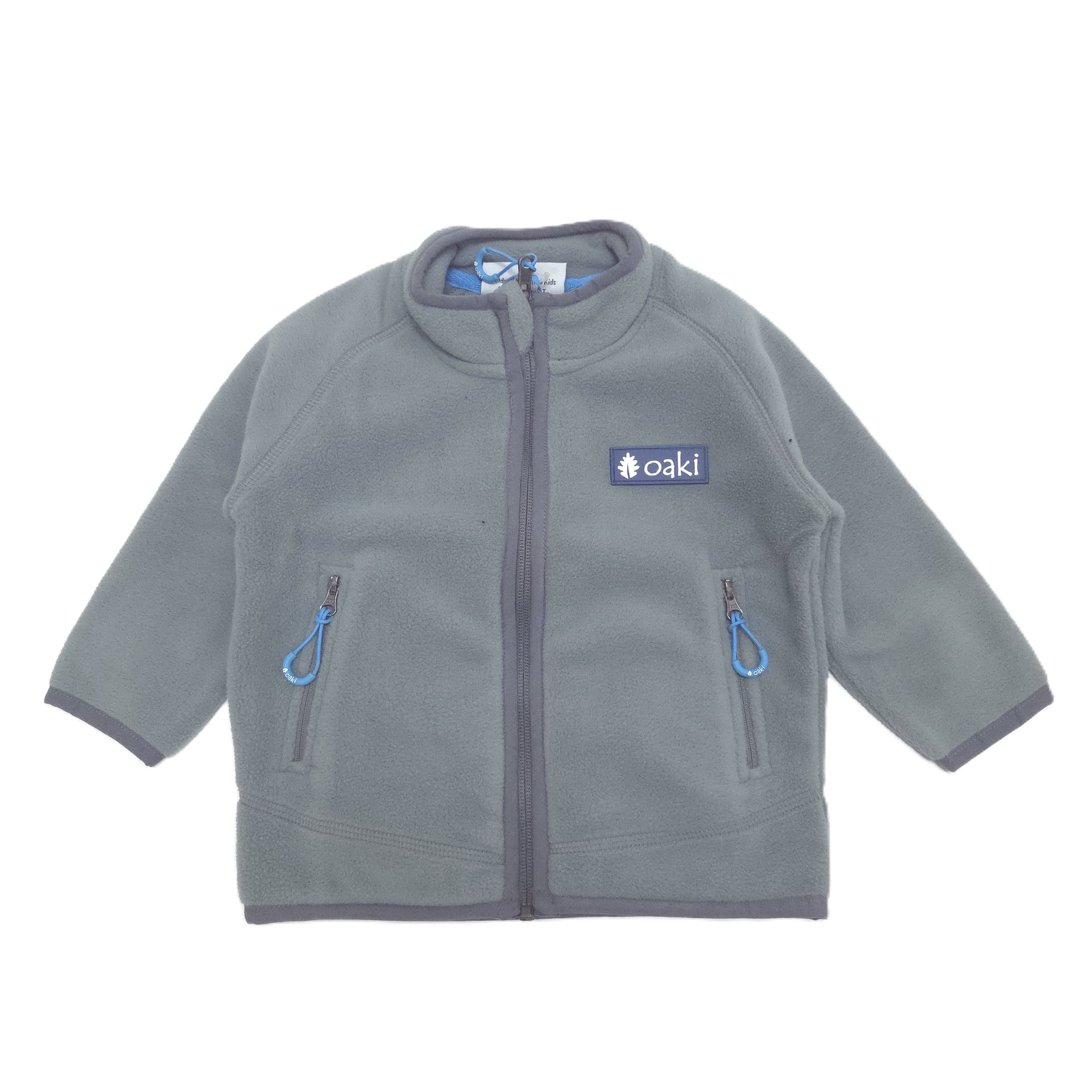 Gray fleece jacket with blue zippers on a white background