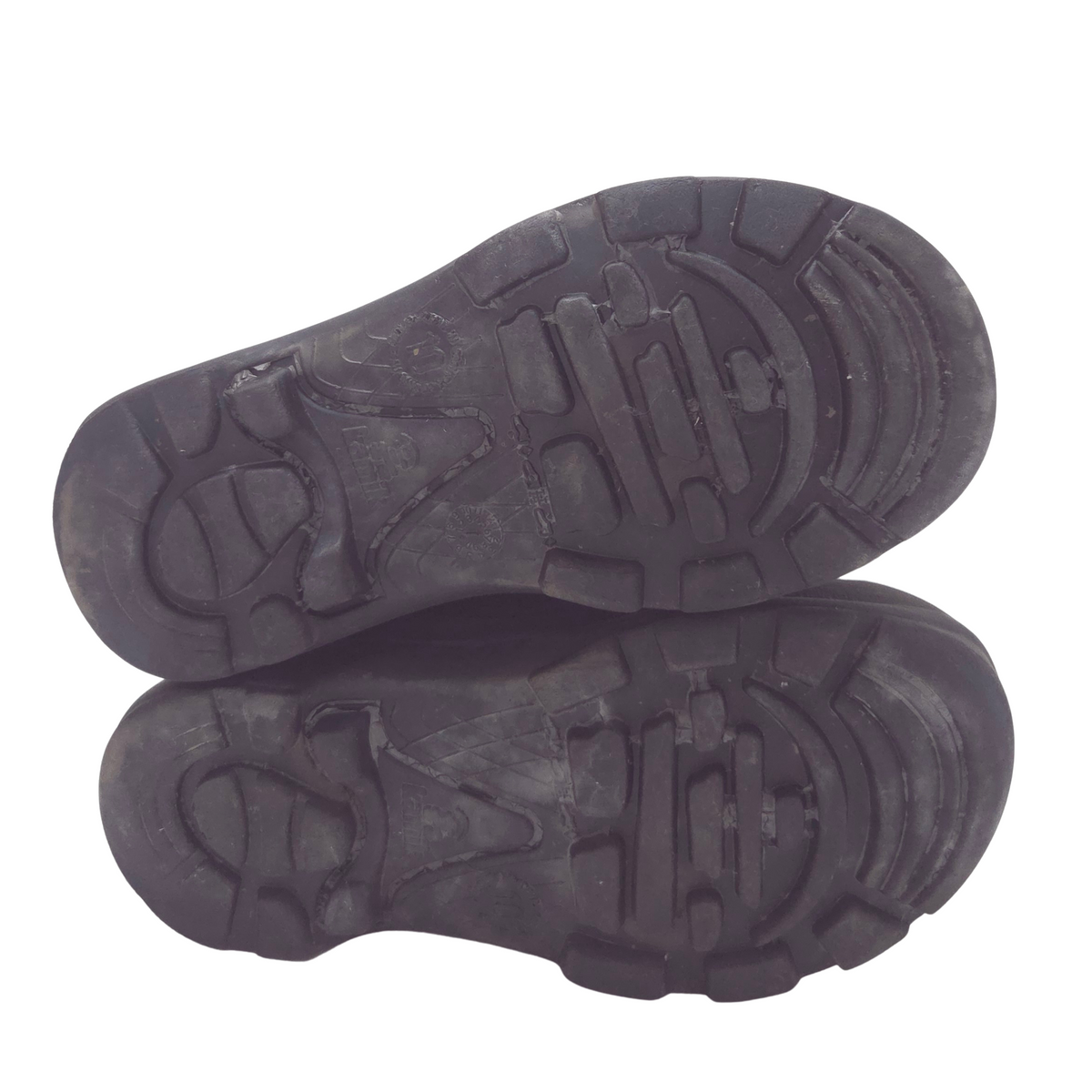 A pair of navy rubber shoe soles shown from the bottom against a plain white background.