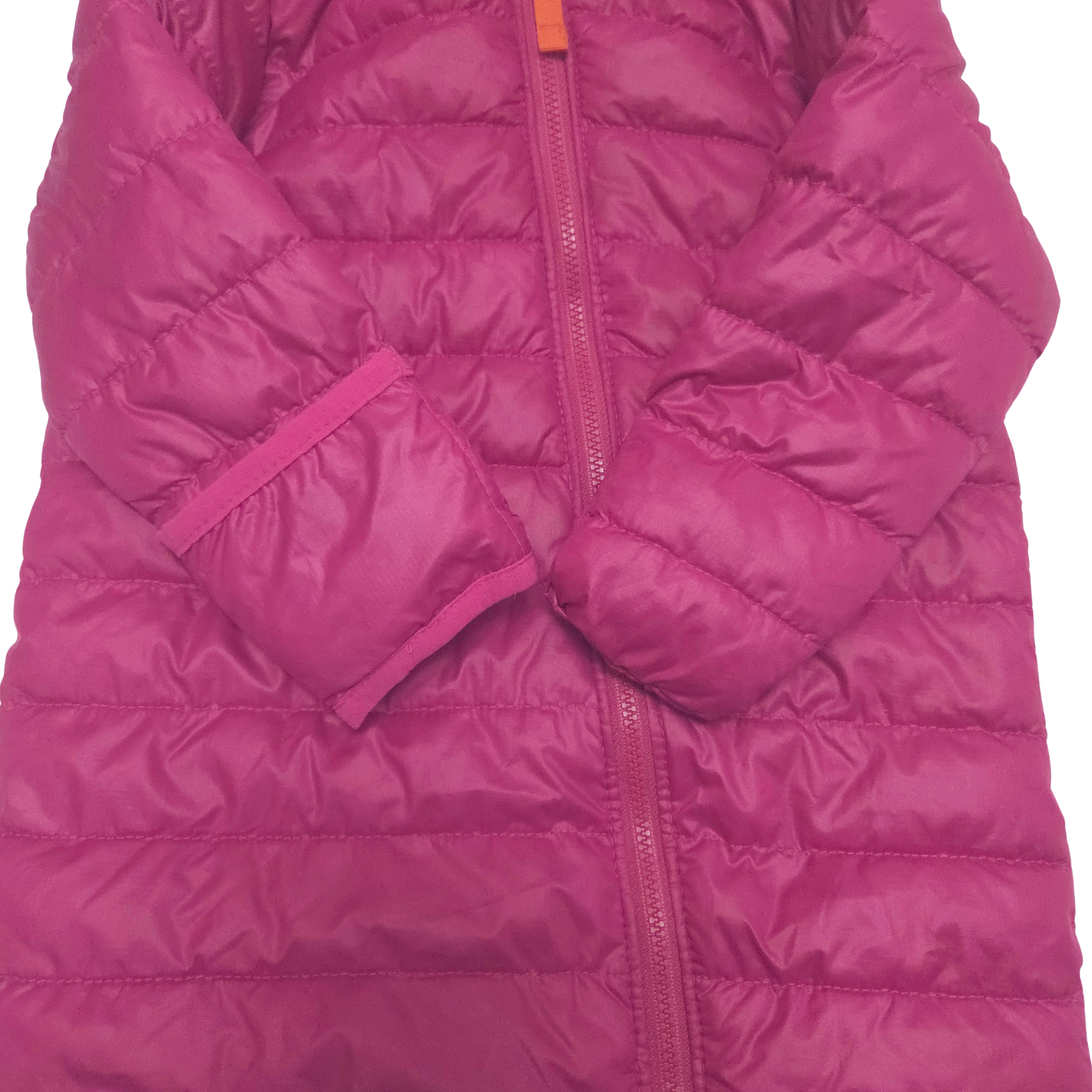 Close-up of a pink puffer jacket on a white background