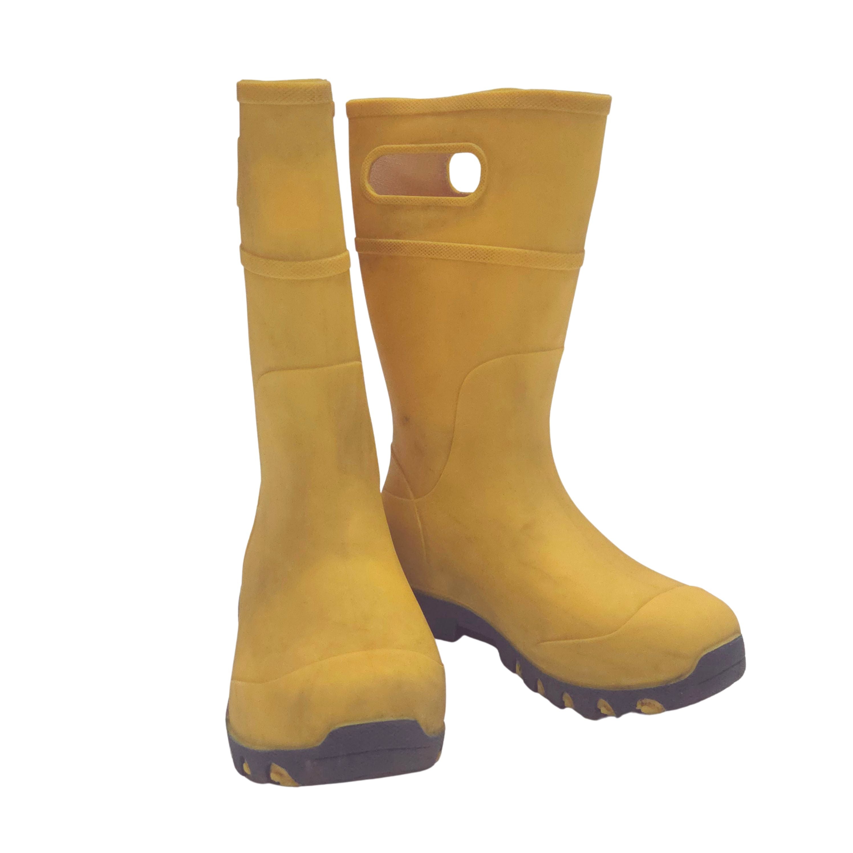 Pair of yellow rubber boots on a white background