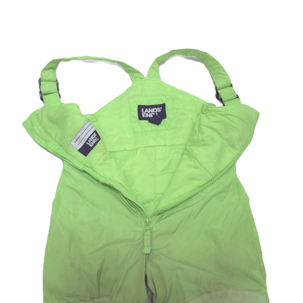 A light green children's snow bib pants with adjustable shoulder straps open detail