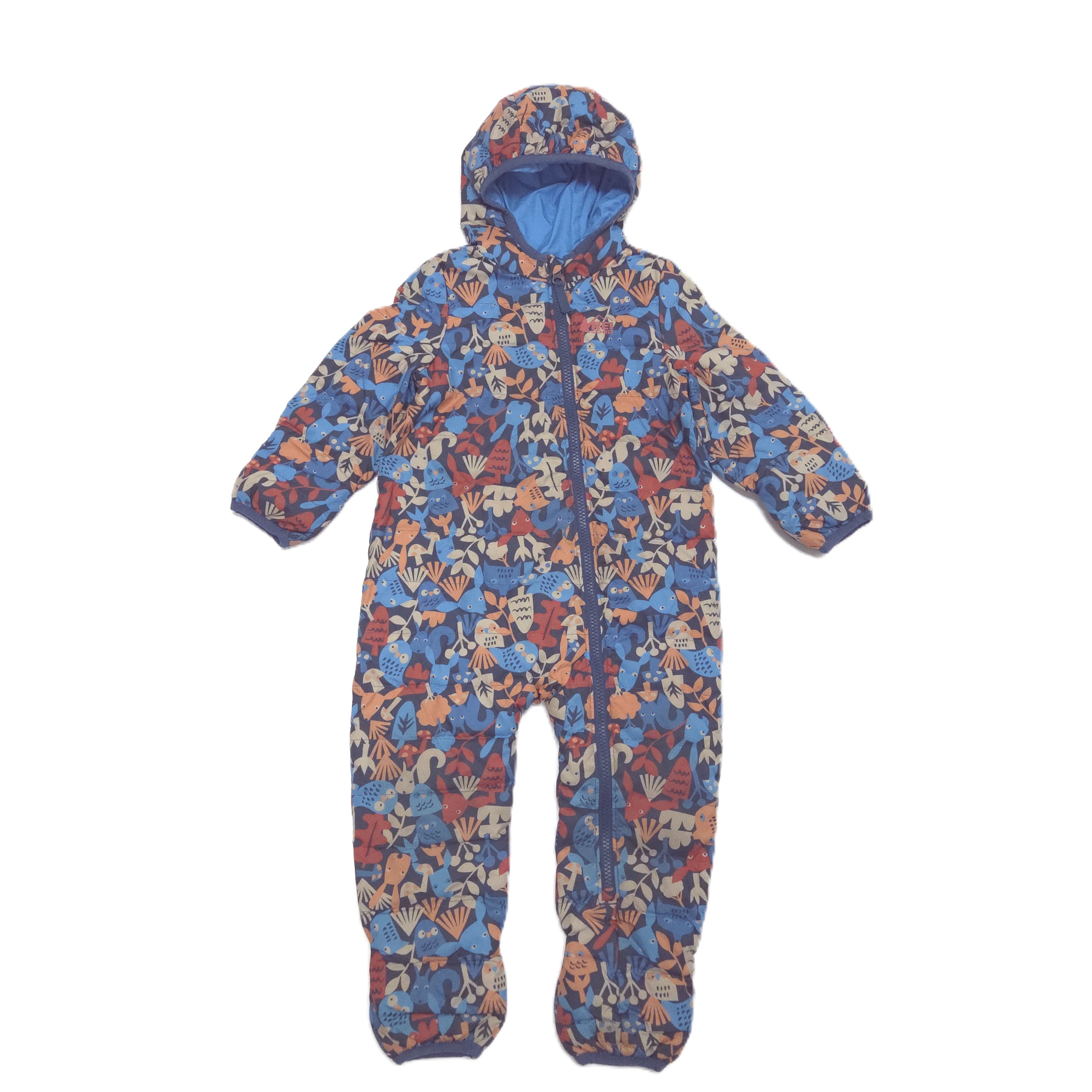 A hooded one-piece baby puffersuit with a colorful cartoon pattern in blue, red, and beige, featuring a front zipper and foot coverings, shown against a plain white background.