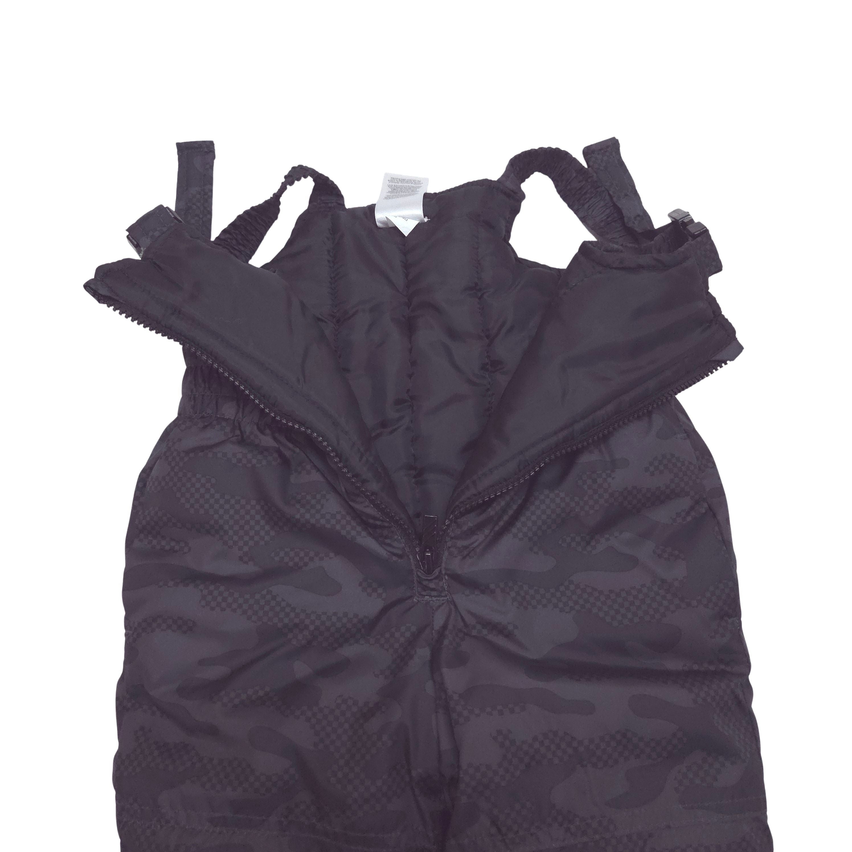 Black camouflage-patterned snow pants with adjustable shoulder straps, laid flat on a white background.