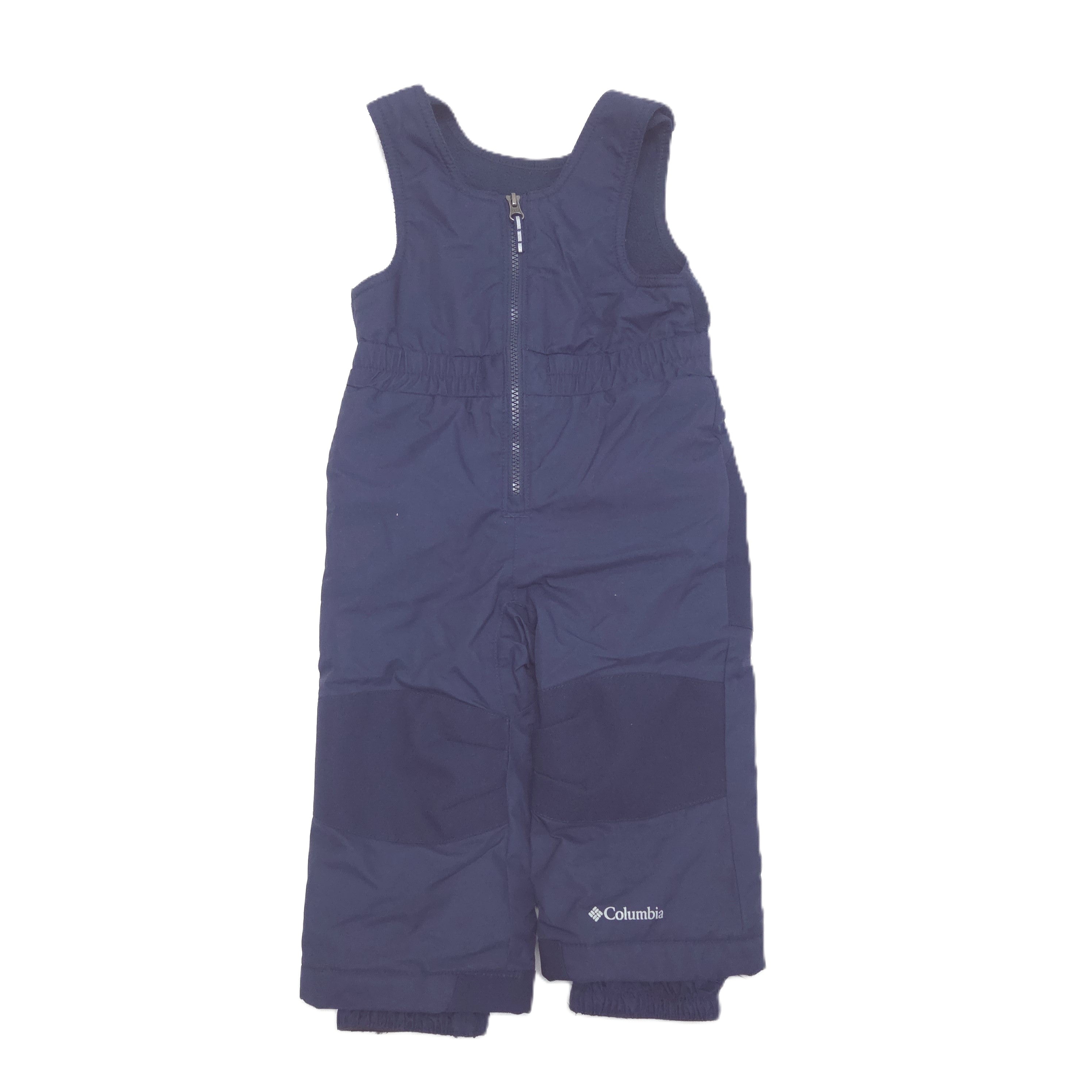A navy blue sleeveless snow bib pants with a half-zip front and a small white Columbia logo on the lower left leg, shown against a plain white background.