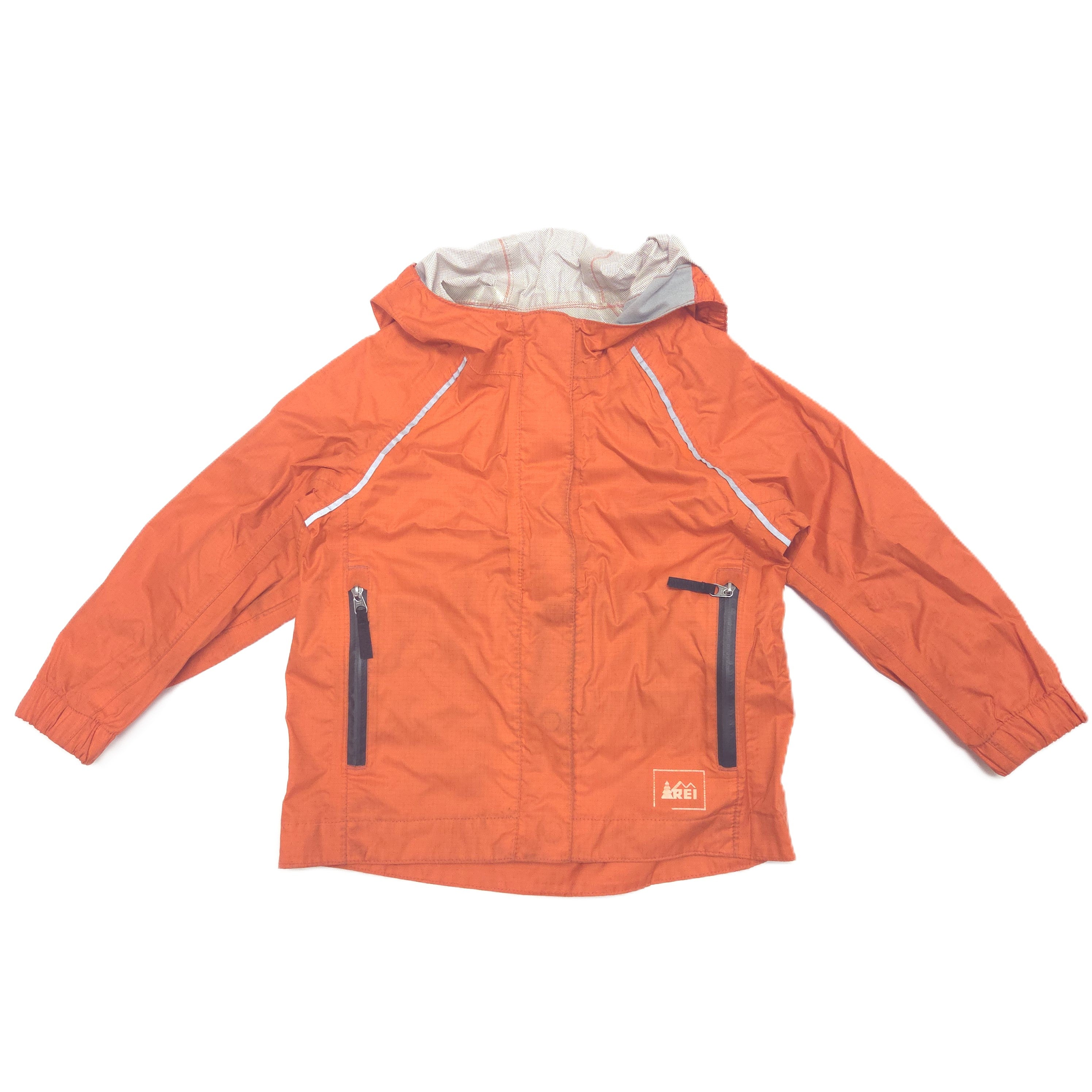 An orange hooded rain jacket with a light gray interior hood lining, featuring two vertical zippered pockets on the front and a small orange brand patch on the lower right front, laid flat against a white background.