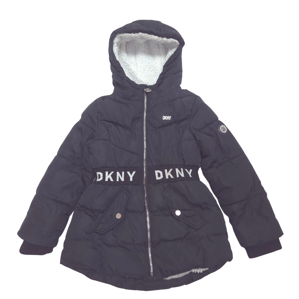 A dark black puffer jacket with 'DKNY' branding across the waist, featuring a white sherpa lining inside the hood and front pockets.