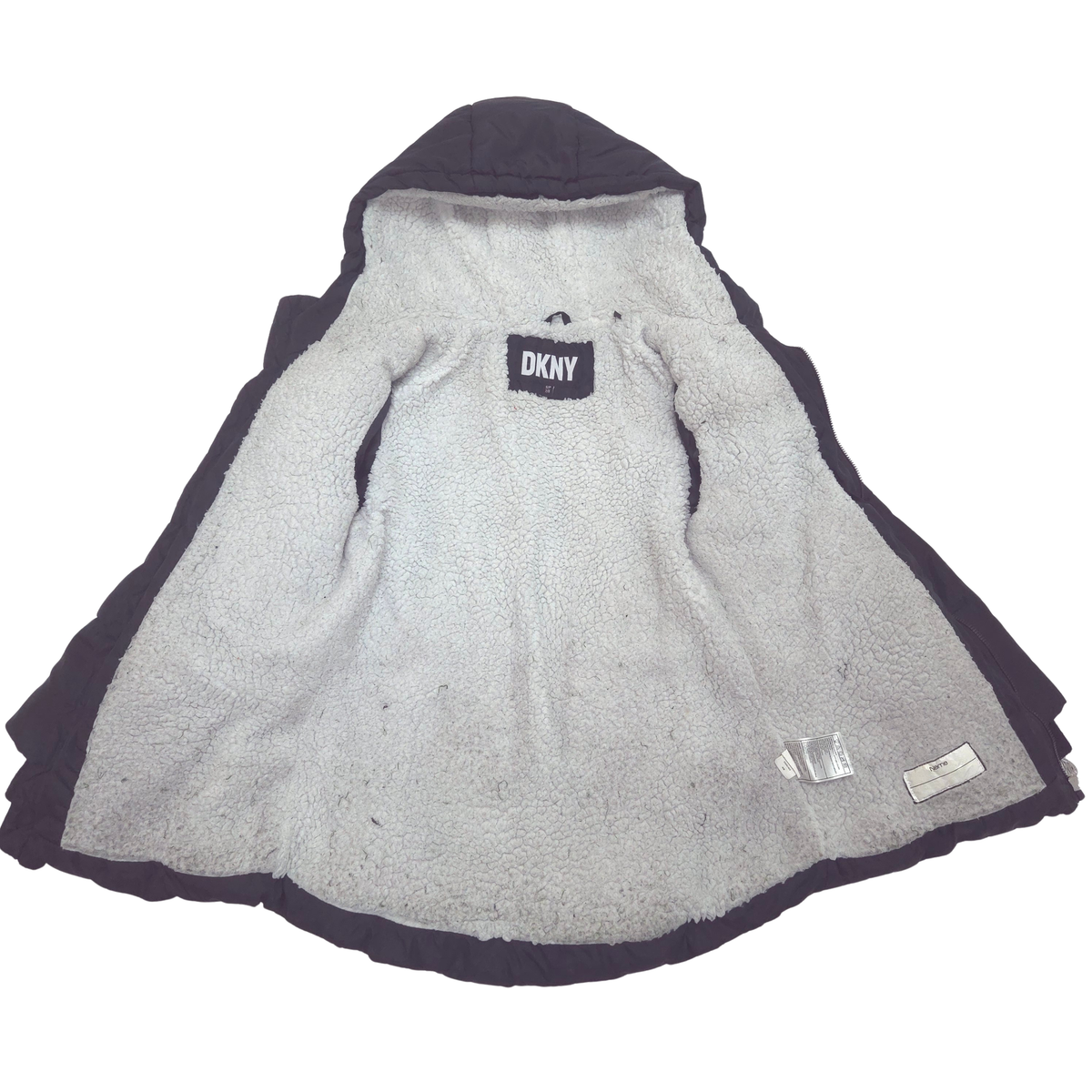 A DKNY hooded winter jacket shown flat against a white background, featuring a light gray sherpa lining.