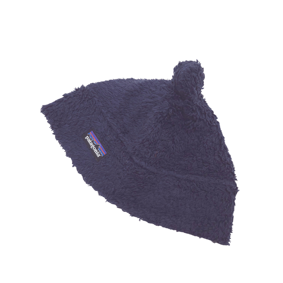 A dark navy blue fuzzy beanie hat with a small bear ears on top and a visible Patagonia logo patch on the side, shown against a plain white background.