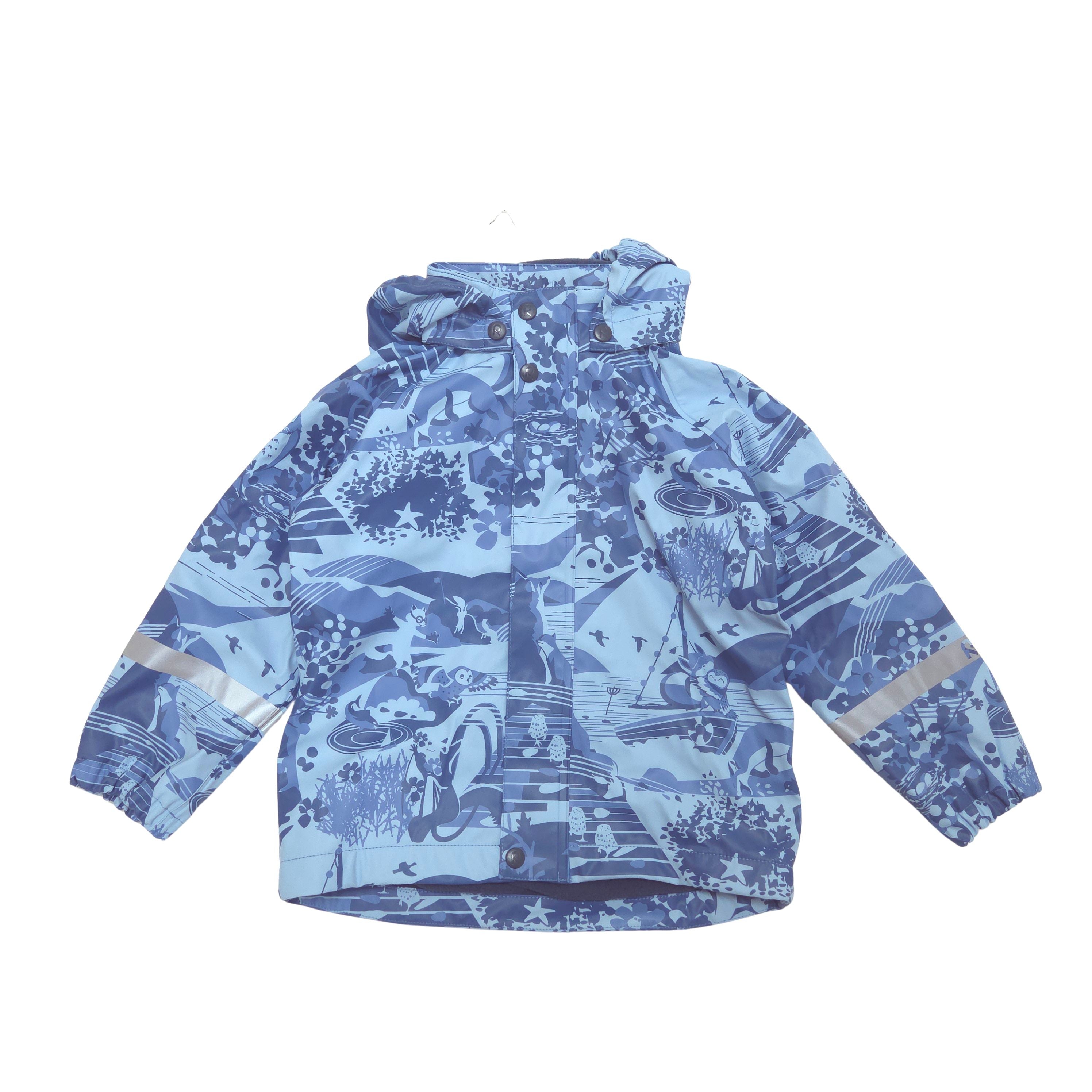 A children's hooded rain jacket with a blue and white scenic pattern, featuring reflective silver stripes on the sleeves, shown flat against a white background.