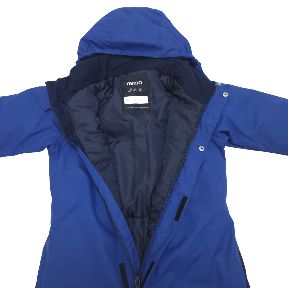A royal blue hooded snowsuit with a black interior lining, laid flat against a white background. The brand name 'reima' is visible on the inner neck label.