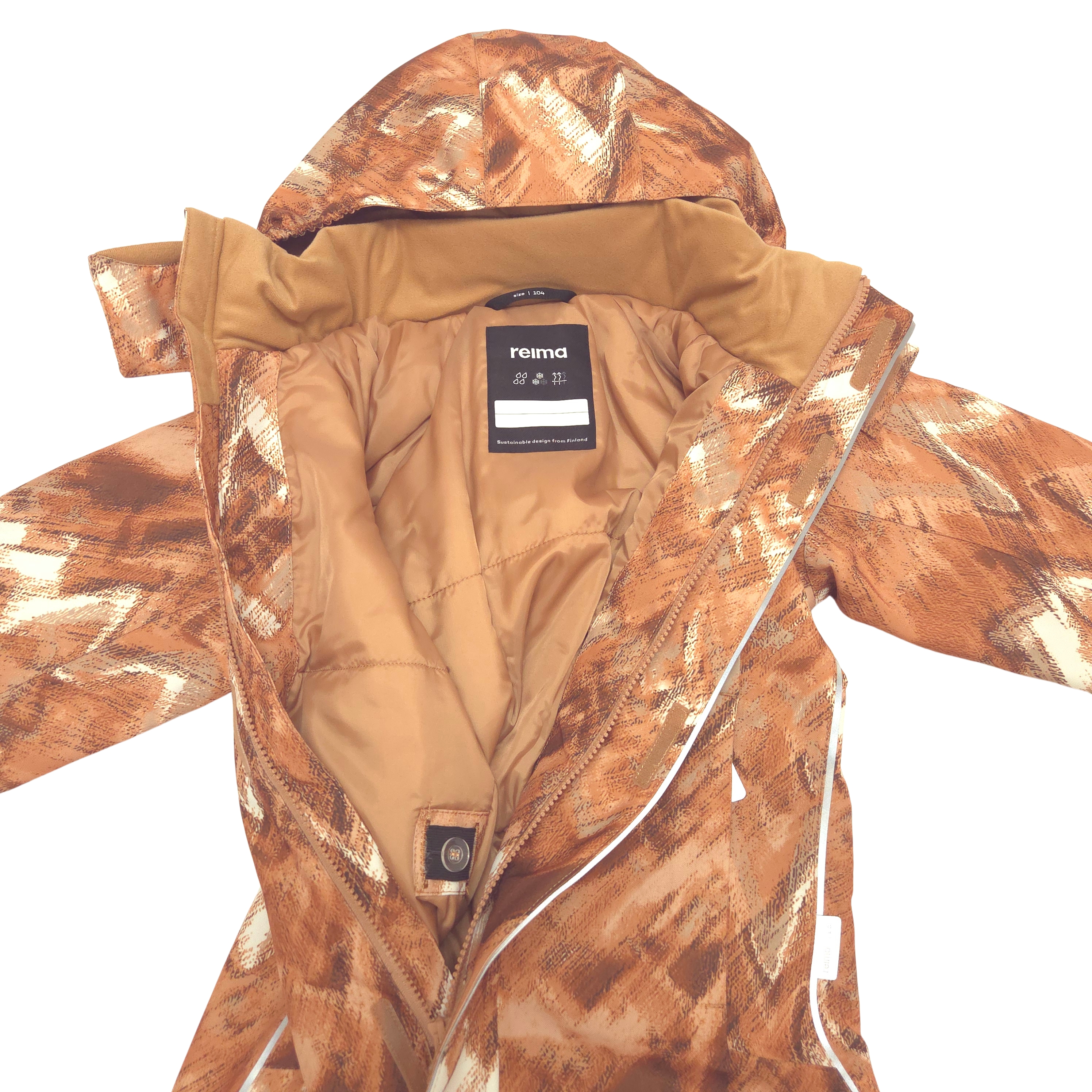 A close-up of a Reima hooded snowsuit with a brown and beige camouflage pattern, showing the tan quilted lining and a black brand label. Integrated waist adjuster with buttons make it easy to fine-tune the fit