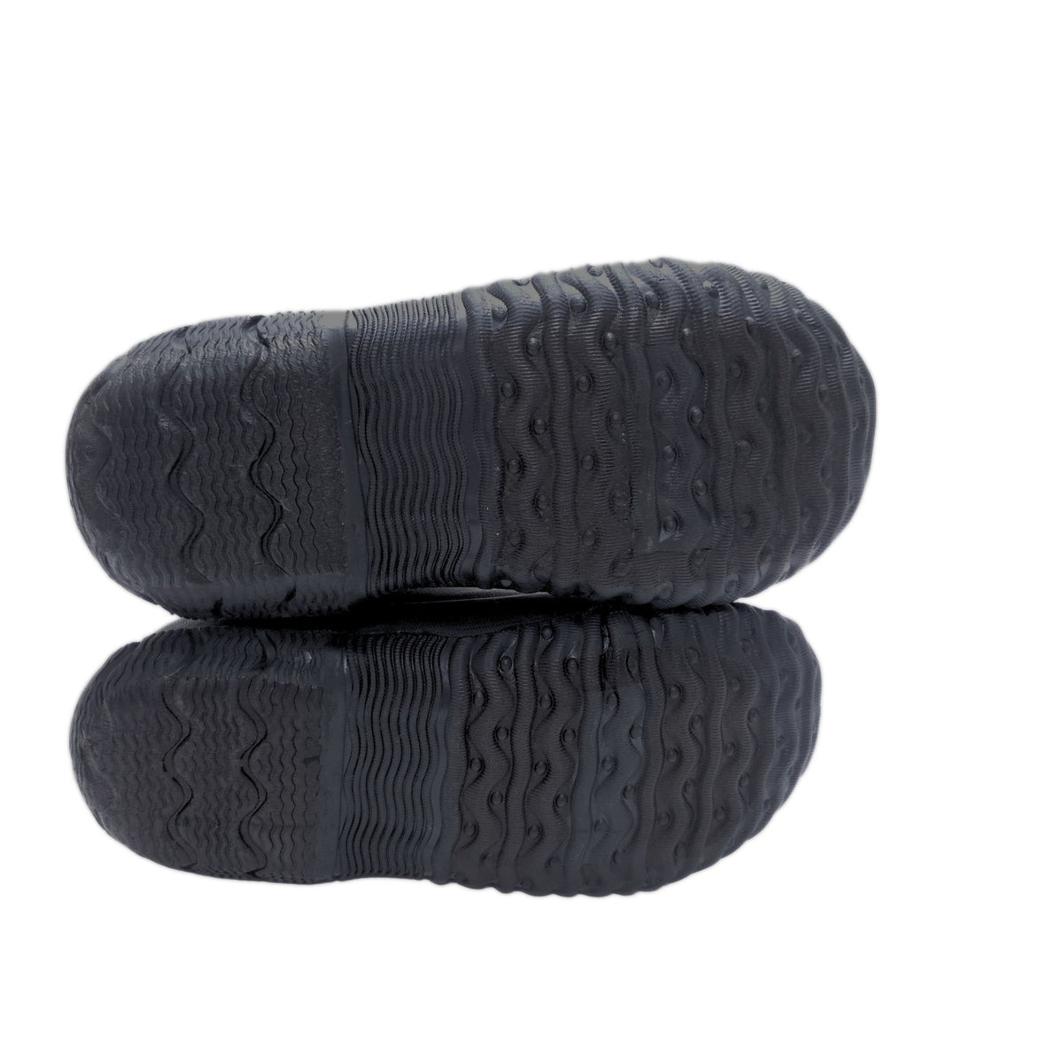 A pair of black rubber shoe soles with deep, textured tread patterns, shown from the bottom against a plain white background.