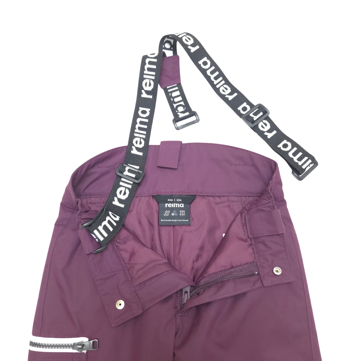 A close-up of a pair of purple shell pants with black adjustable waist straps featuring the white 'reima' logo, shown against a plain white background.