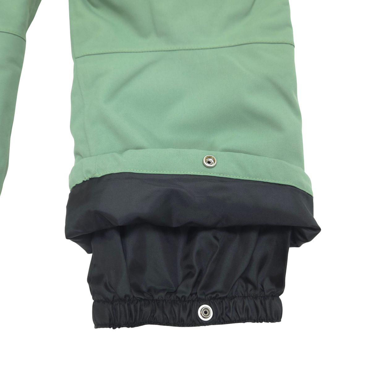 Internal gaiters at cuffs keep out snow; external scuff guards protect from boot- and ski-edge wear