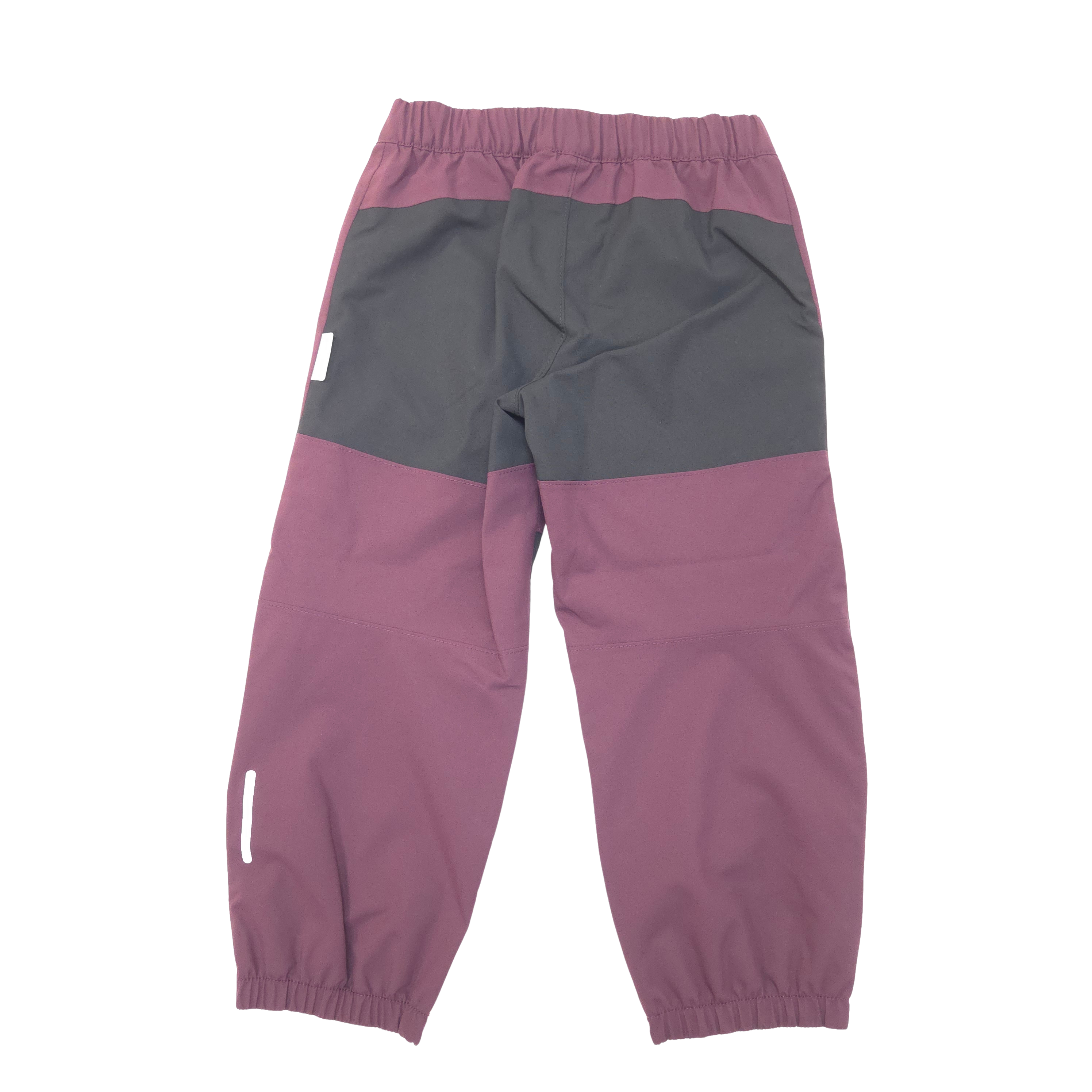 A pair of color-blocked children's pants in dusty purple and black, shown from the back on a white background.
