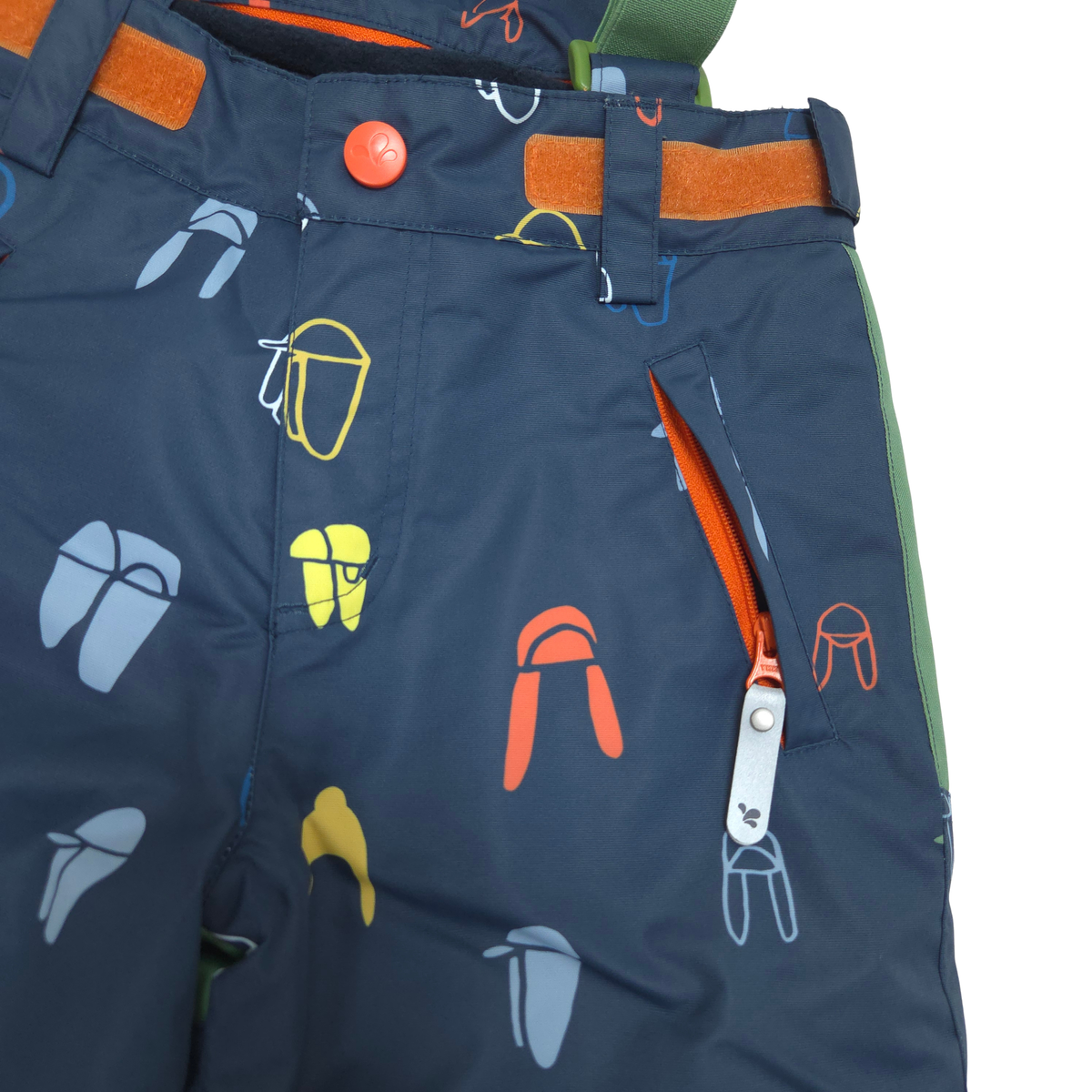 Close-up of dark navy children's snow pants with a colorful outdoor gear print, including orange, yellow, and light blue icons. Features a zippered pocket with an orange lining and a silver zipper pull.