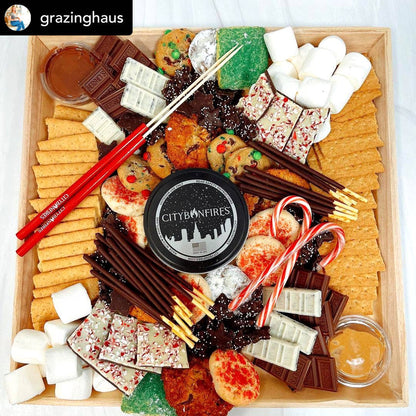 Grazing board with various snacks including cookies, crackers, and chocolate, with 'City Bonfires' branding.