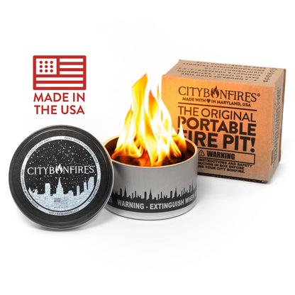City Bonfires portable fire pit with flame, packaging, and 'Made in the USA' label on a white background.