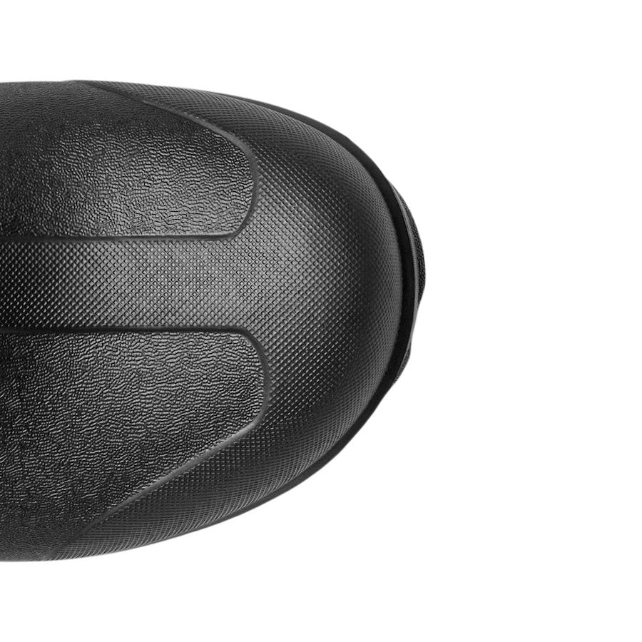 Close-up of a black textured protective helmet or shell on a plain white background.