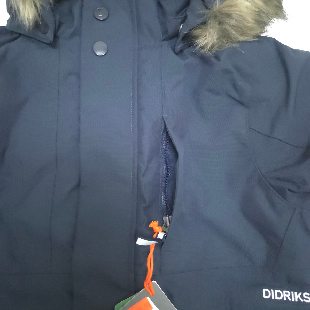 Covered, zippered chest pocket