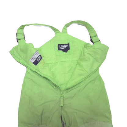 A light green children's snow bib pants with adjustable shoulder straps open detail