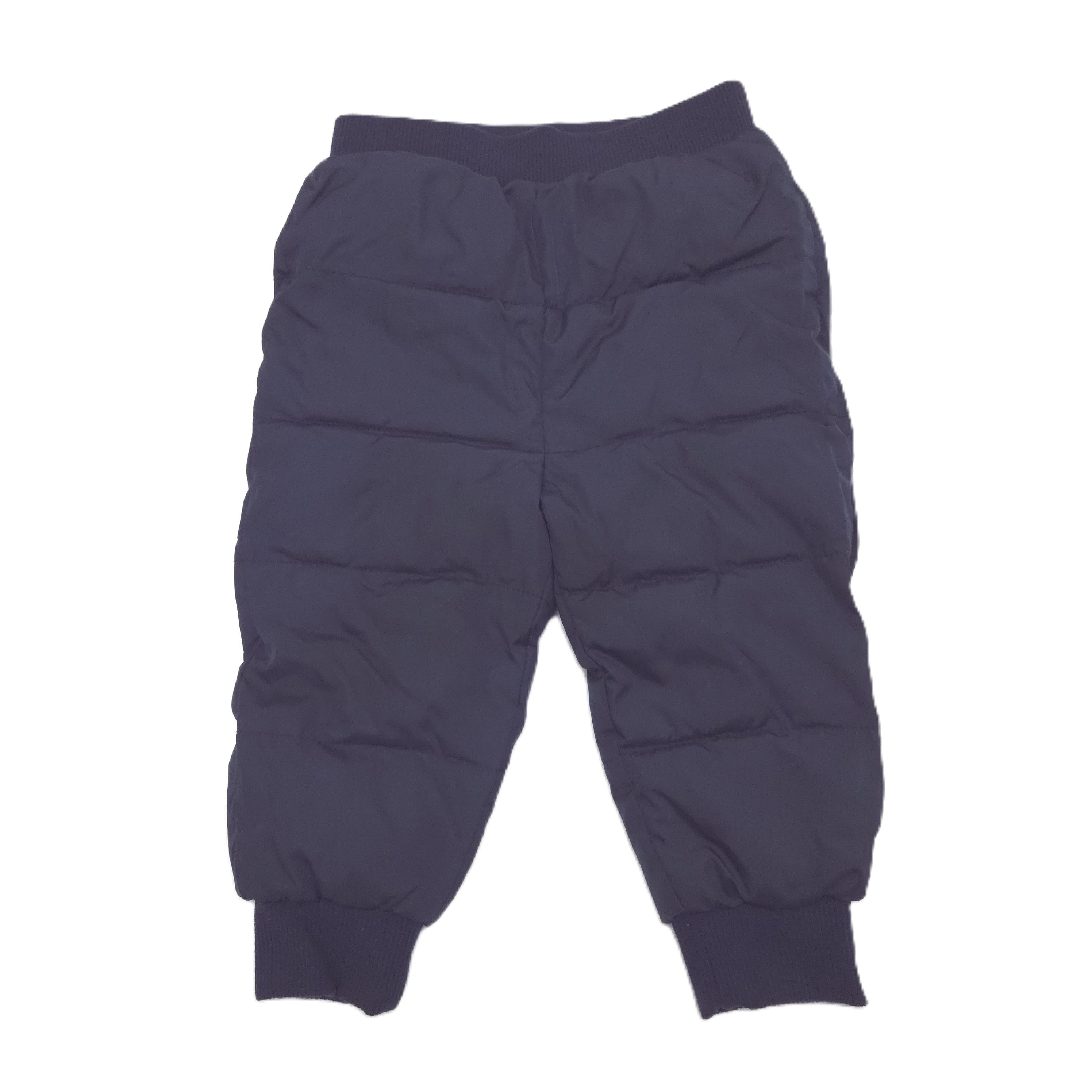 A pair of dark navy blue puffer pants with horizontal quilted stitching, elastic waistband, and ribbed ankle cuffs, shown flat against a white background.