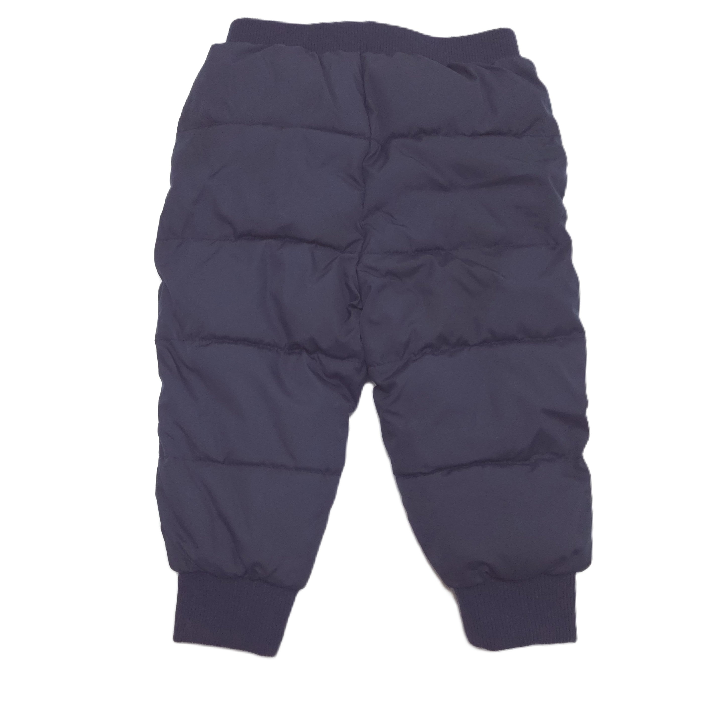 A pair of dark navy blue puffer pants with horizontal quilting, elastic waistband, and ribbed ankle cuffs back image.