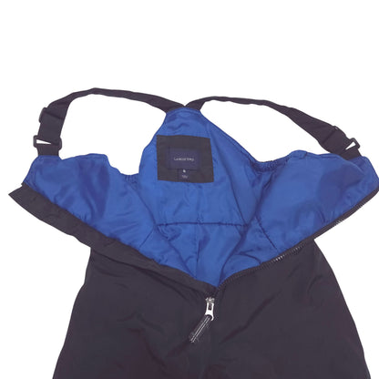 Black bib snowpants with adjustable shoulder straps and blue lining