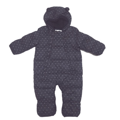 A black hooded snowsuit with a small white polka dot pattern, laid flat on a white background.