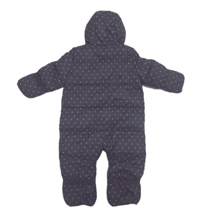 A black hooded snowsuit with a small white polka dot pattern, laid flat on a white background back image
