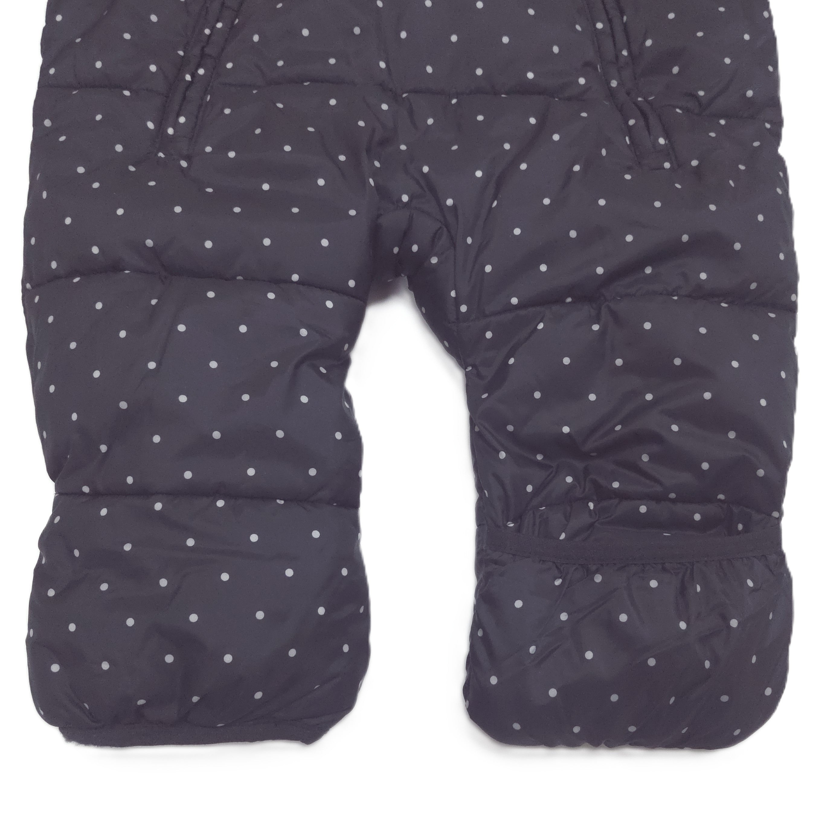 A black hooded snowsuit with a small white polka dot pattern fold-over booties