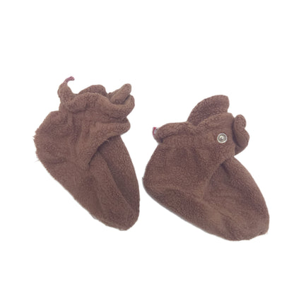 A pair of plush brown baby booties with snaps