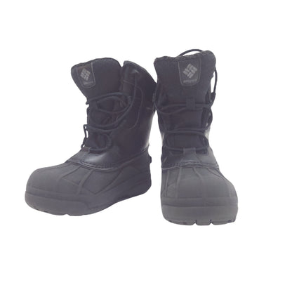A pair of black Columbia snow boots with laces, shown from the side against a plain white background.