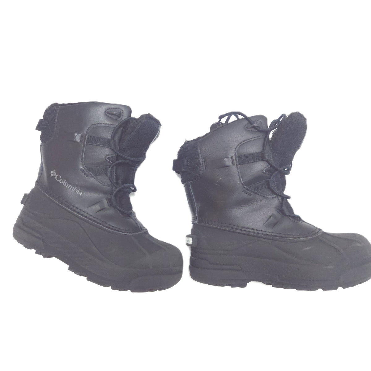 A pair of black Columbia snowboard boots with laces and hook-and-loop straps, shown against a plain white background.