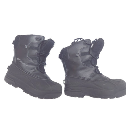 A pair of black Columbia snowboard boots with laces and hook-and-loop straps, shown against a plain white background.