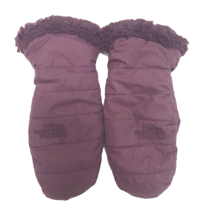 A pair of The North Face quilted winter mittens in a dusty mauve-purple color, featuring a dark brown faux-fur trim at the cuff and the brand's logo on the lower left of each mitten.