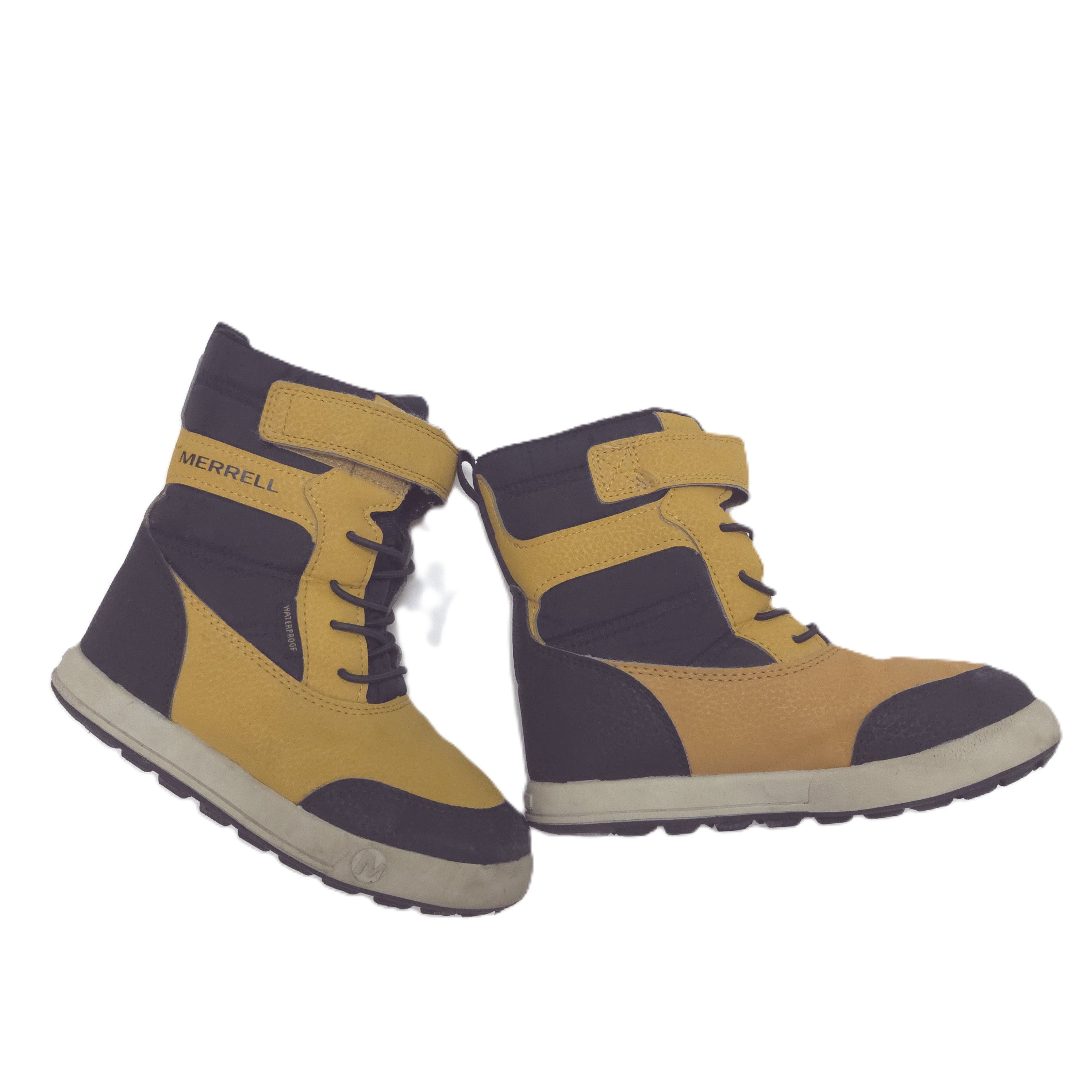 A pair of low-top Merrell boots in mustard yellow and black, featuring a hook-and-loop strap closure and a thick off-white sole.