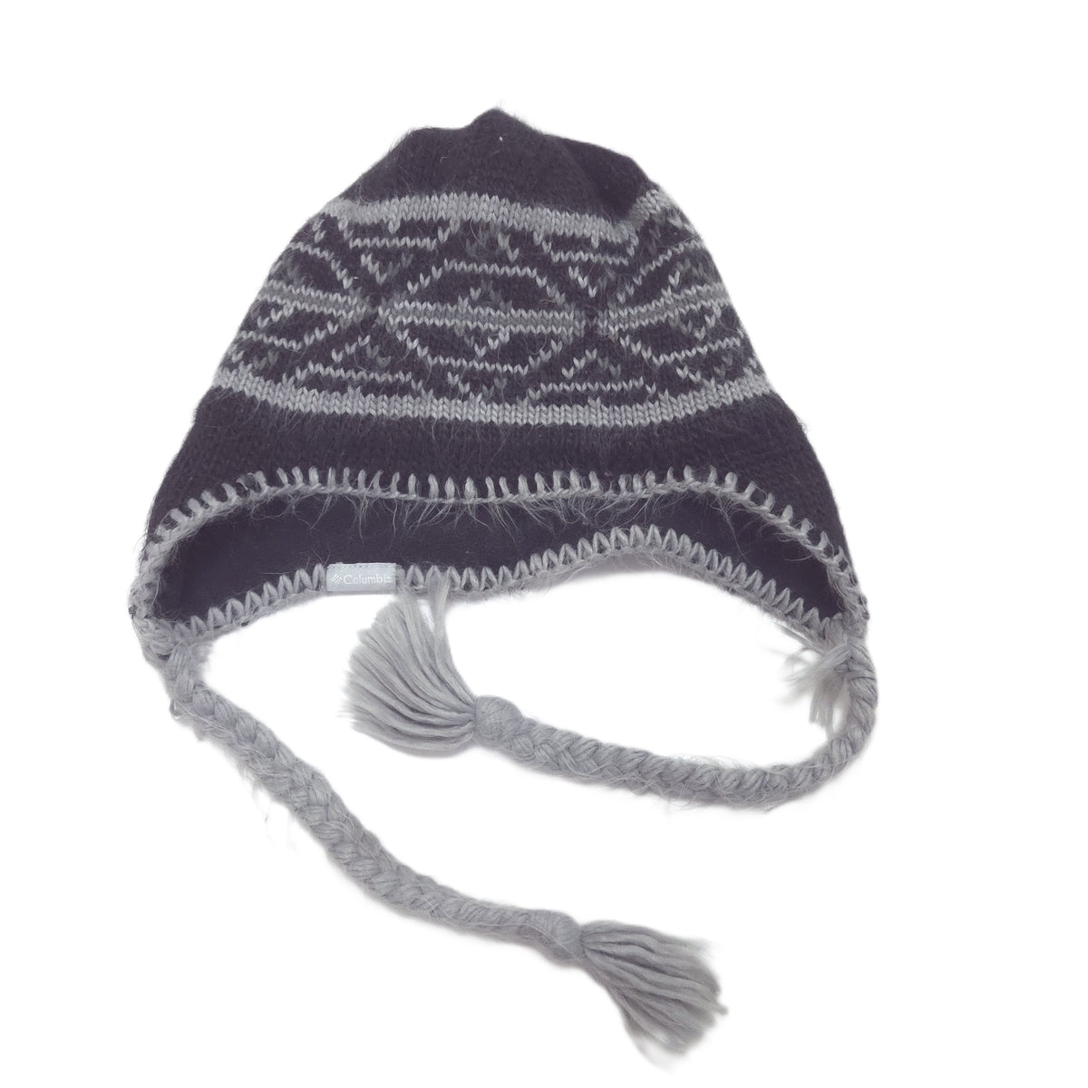 A dark gray knit winter hat with a light gray geometric pattern, ear flaps, and braided tassels, shown on a plain white background.