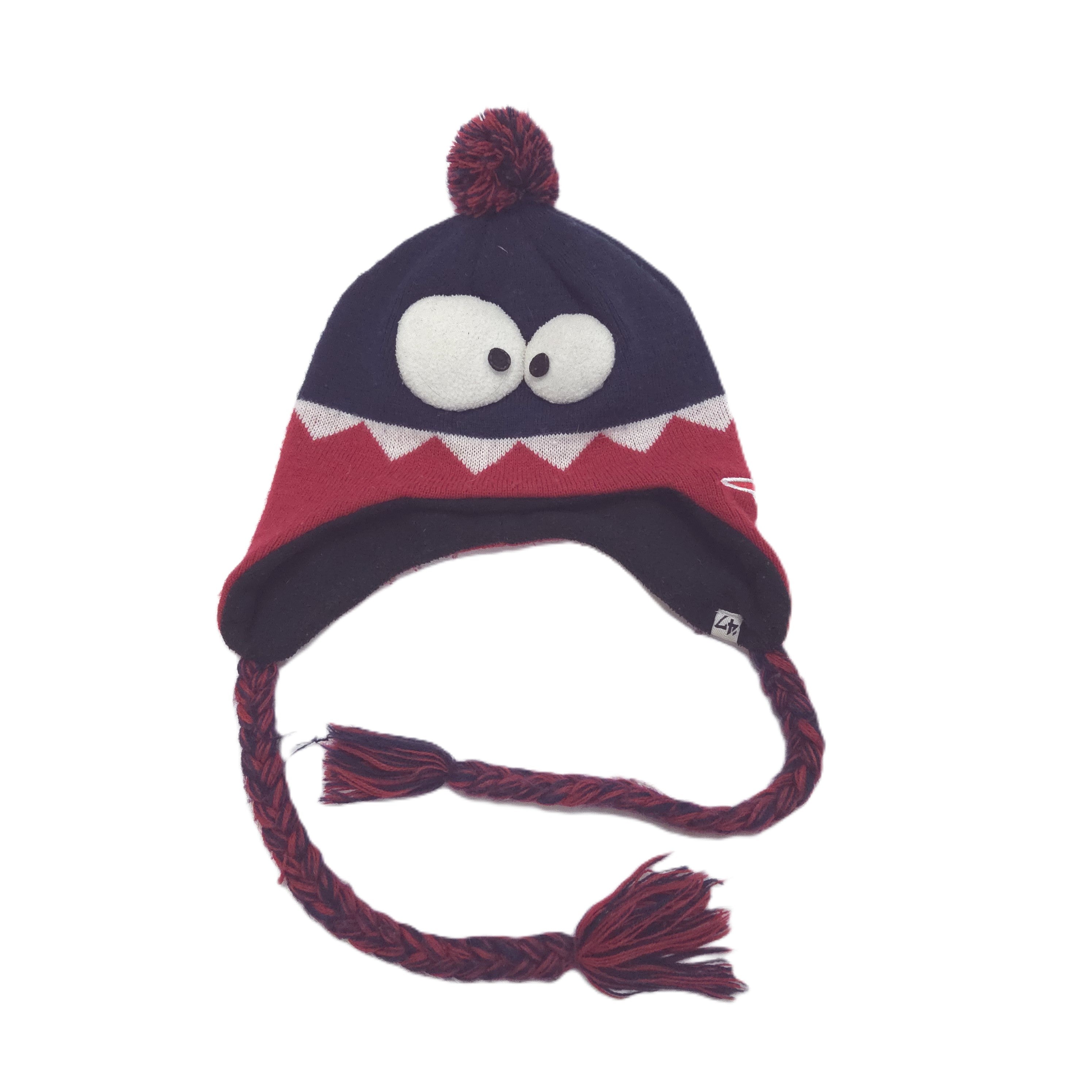 A dark navy blue knit winter hat with a red band, white cartoon eyes, and a red pom-pom on a white background.