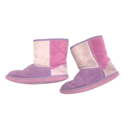 A pair of low-top patchwork suede boots in shades of purple, pink, and beige, shown against a plain white background.
