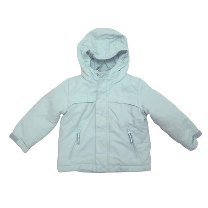 A light blue hooded jacket with zippered pockets, laid flat against a white background.