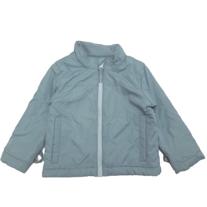 A removable inner light blue-gray zip-up jacket with a stand-up collar, laid flat against a white background.