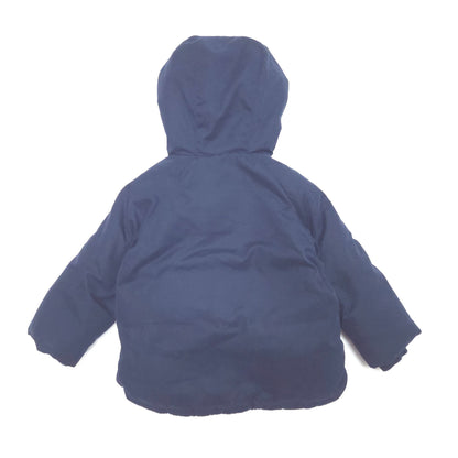 A navy blue hooded puffer jacket shown from the back, laid flat against a solid white background.
