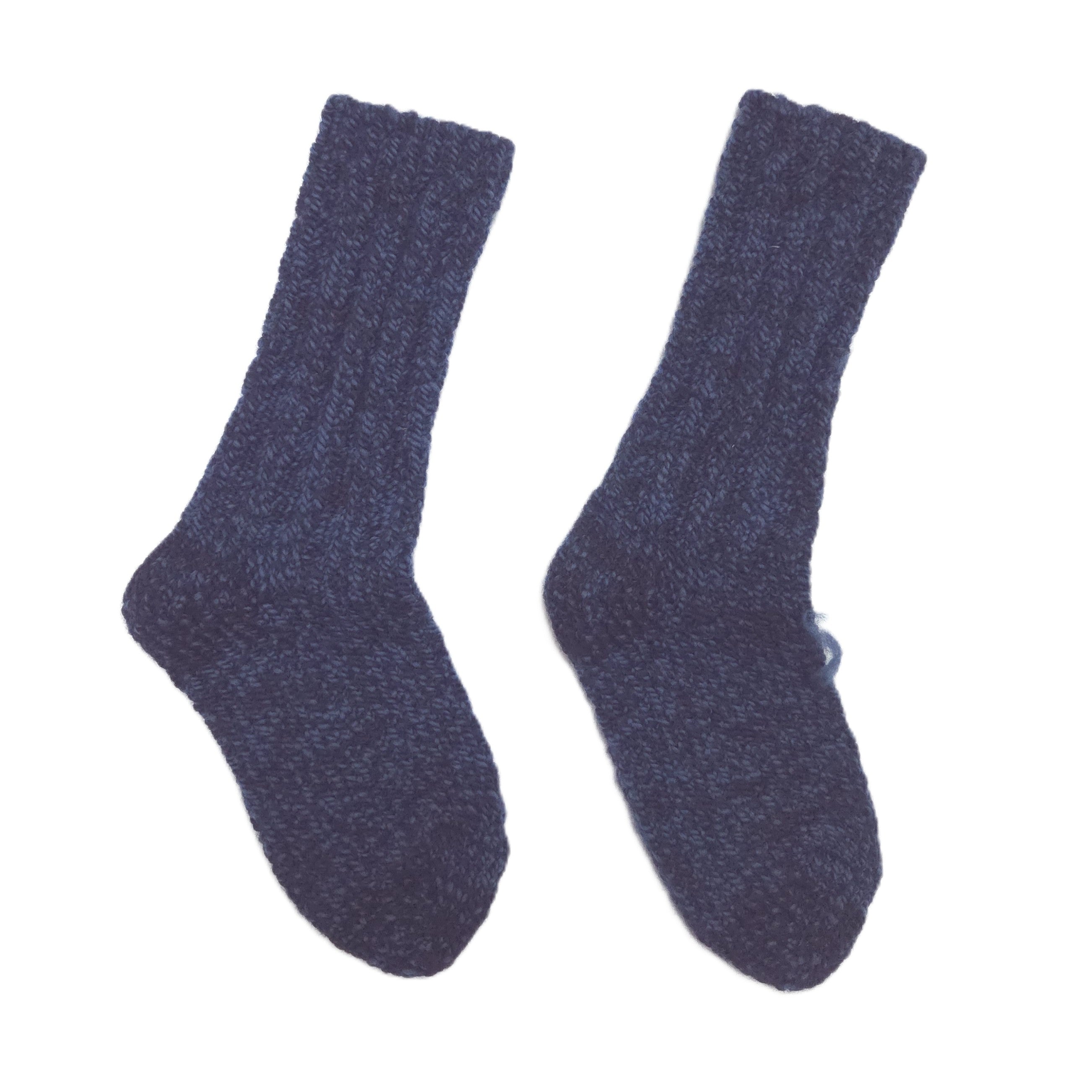A pair of dark navy blue ribbed knit  socks shown against a plain white background.