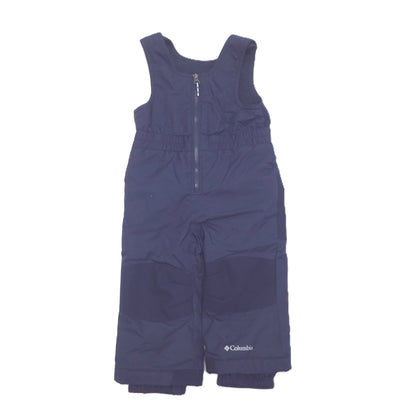 A navy blue sleeveless snow bib pants with a half-zip front and a small white Columbia logo on the lower left leg, shown against a plain white background.