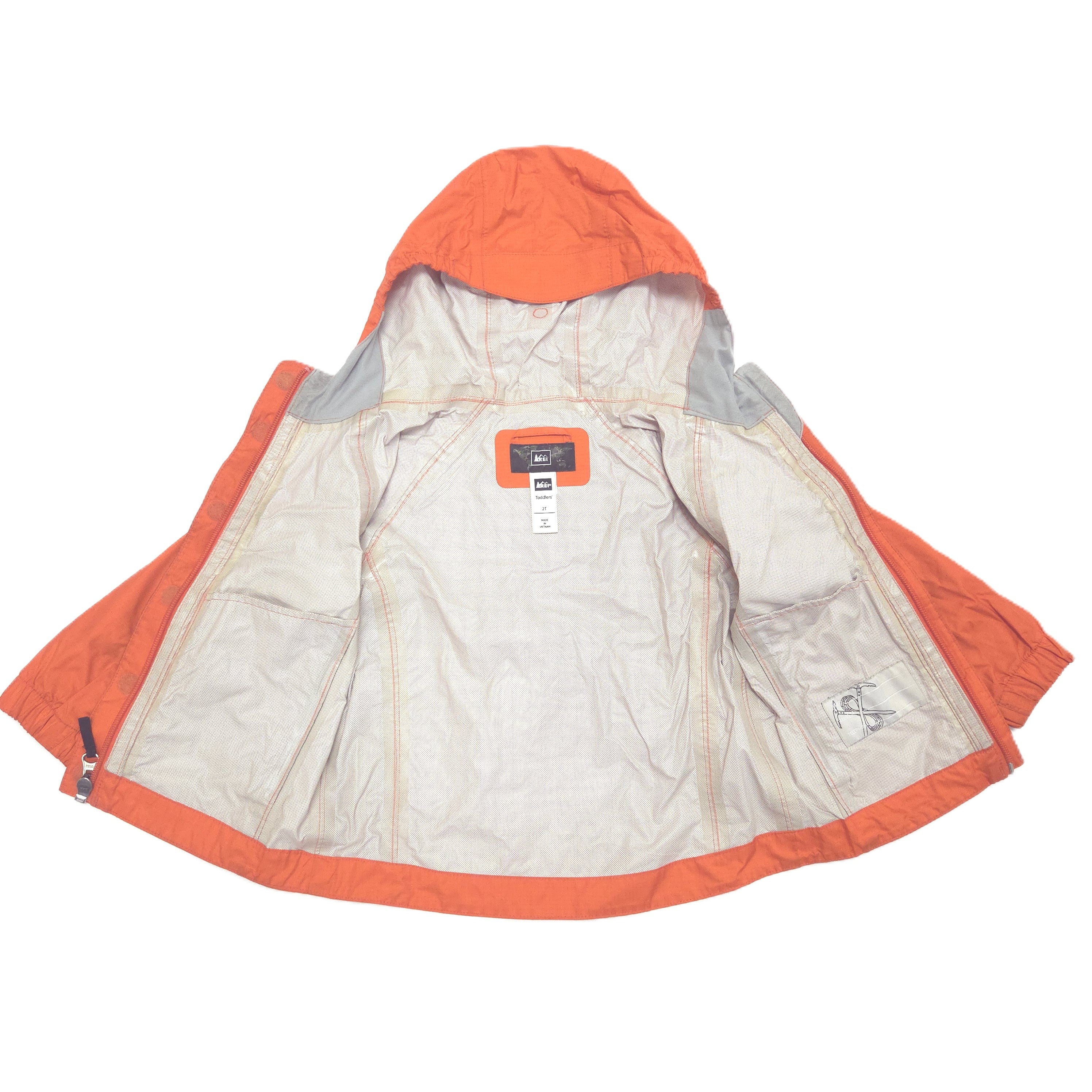 An orange hooded jacket with a light beige lining, laid flat against a white background.