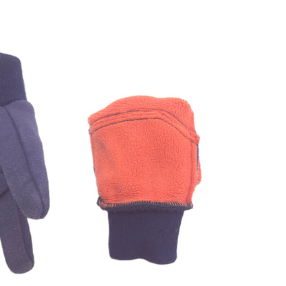 A close-up of a glove showing the inner fleece lining in orange and the ribbed cuff in dark navy blue, with another glove partially visible on the left.