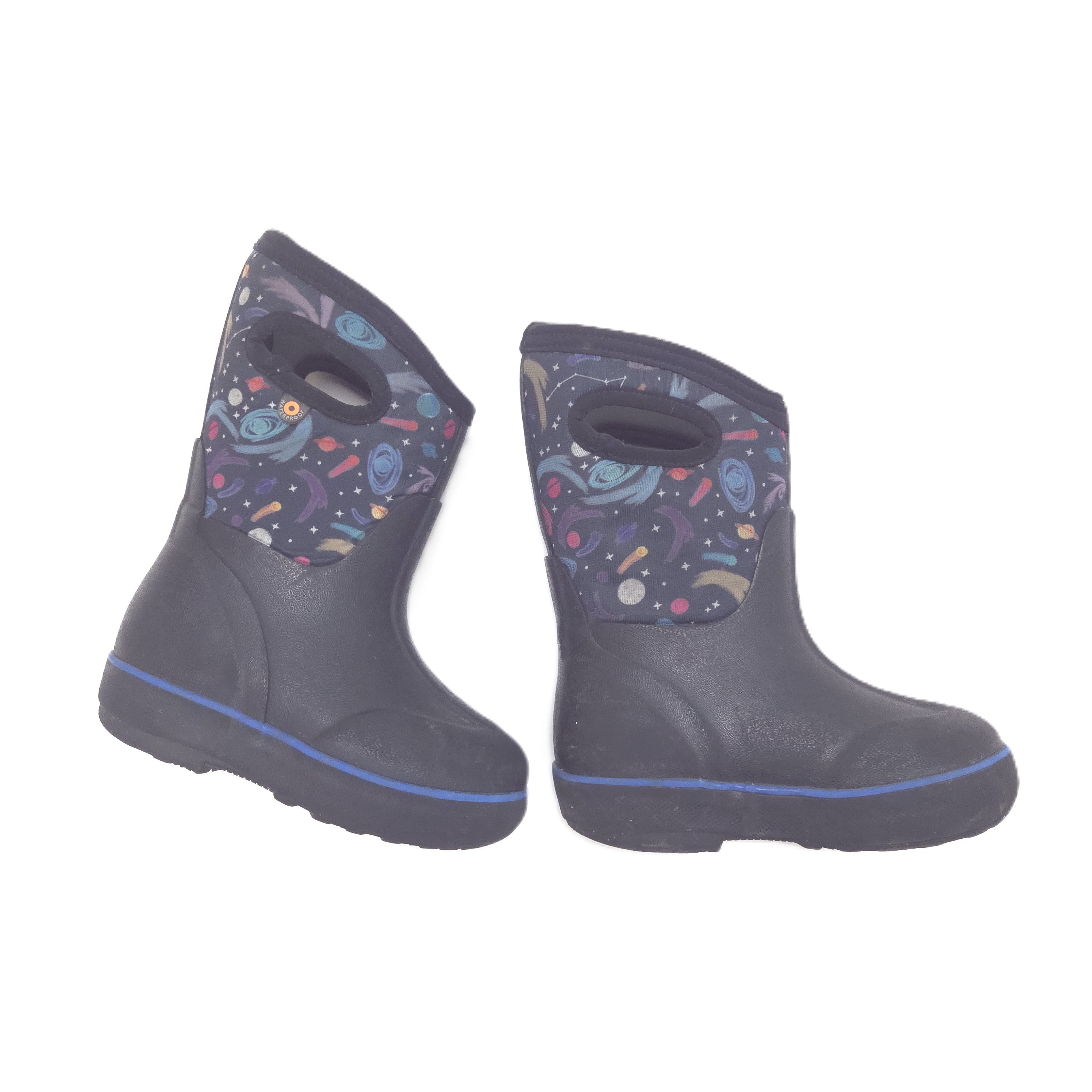 A pair of winter boots in black, featuring a colorful space-themed print on the upper shaft with planets, stars, and rockets.